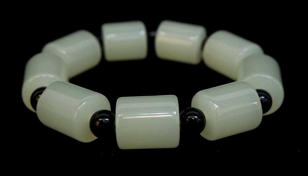 Appraisal: Jade Bracelet Jade Bracelet Description Conical shaped white jade beads