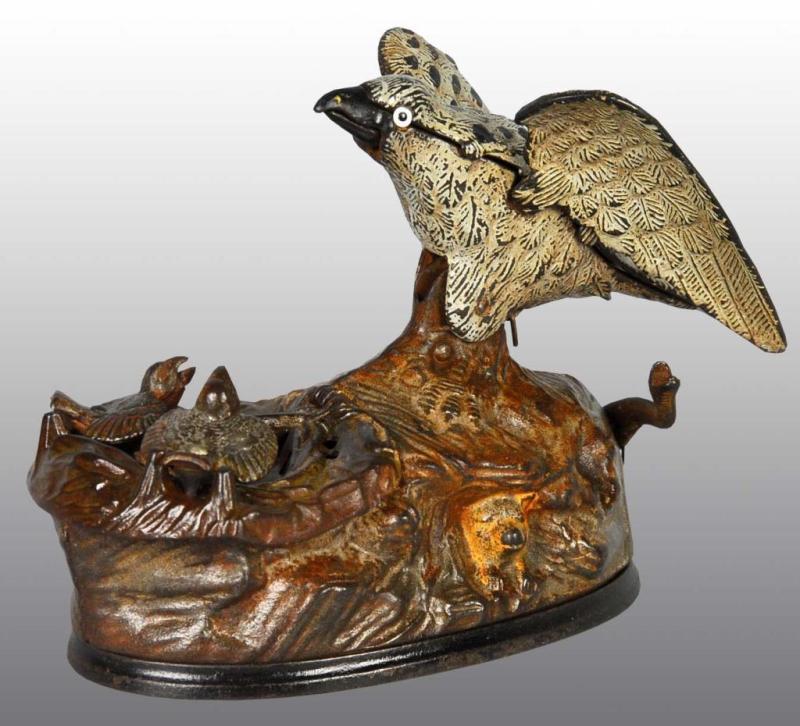 Appraisal: Cast Iron Eagle Eaglettes Mechanical Bank Description Manufactured by J