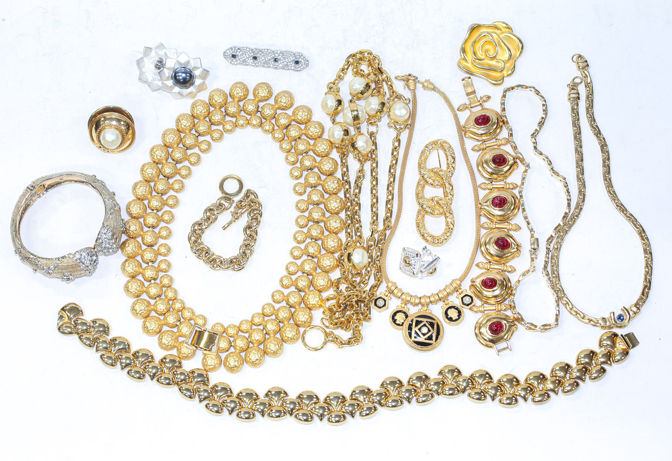 Appraisal: A COLLECTION OF GOLD-TONE COSTUME JEWELRY Including a large CZ