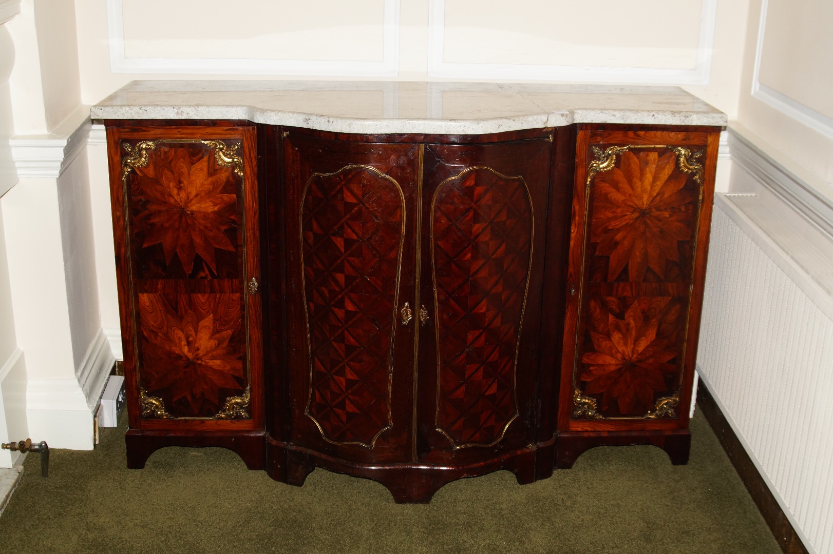 Appraisal: A thC French figured walnut and marquetry credenza with gilt