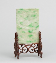 Appraisal: A Carved Jadeite Plaque on a Carved Stand A Burmese