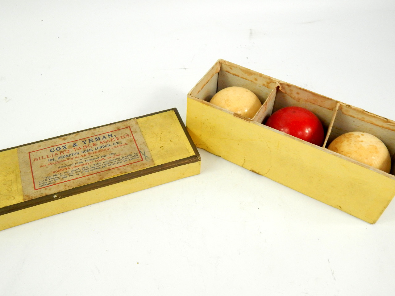 Appraisal: A set of Cox Yeman ivory billiards balls one red