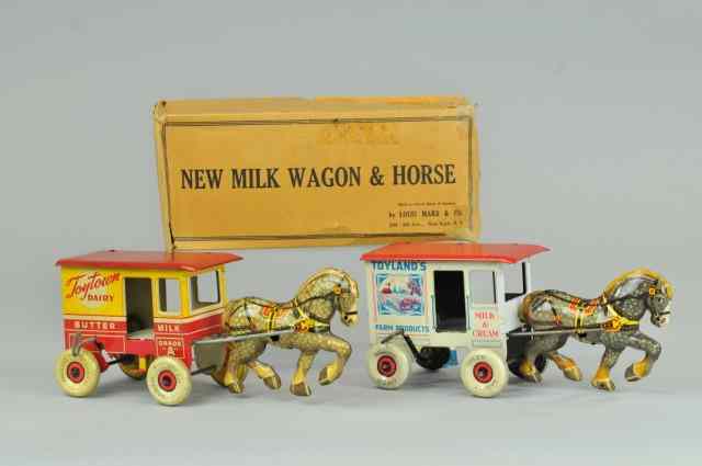 Appraisal: TOYTOWN AND TOYLAND DAIRY WAGONS Marx Toys lithographed tin Toyland