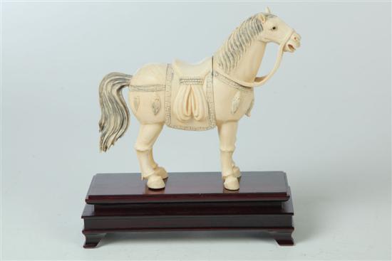 Appraisal: CARVED IVORY HORSE China early th century Standing horse with