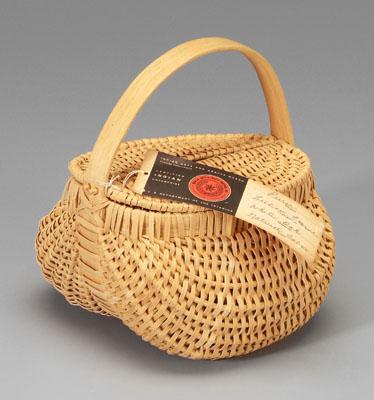 Appraisal: Cherokee oak split lidded purse double-hinged top above egg basket