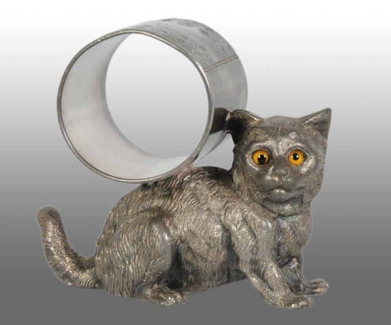 Appraisal: Large Cat with Glass Eyes Figural Napkin Ring Description Marked