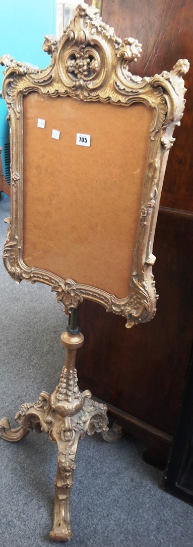 Appraisal: A th century gilt framed fire screen on a carved