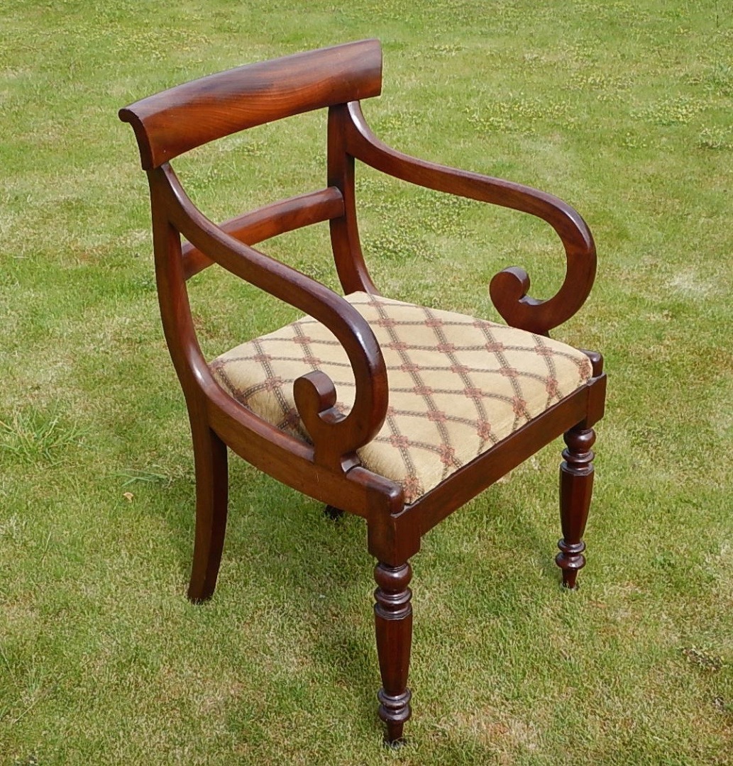 Appraisal: An early Victorian mahogany carver with plain scroll arms and