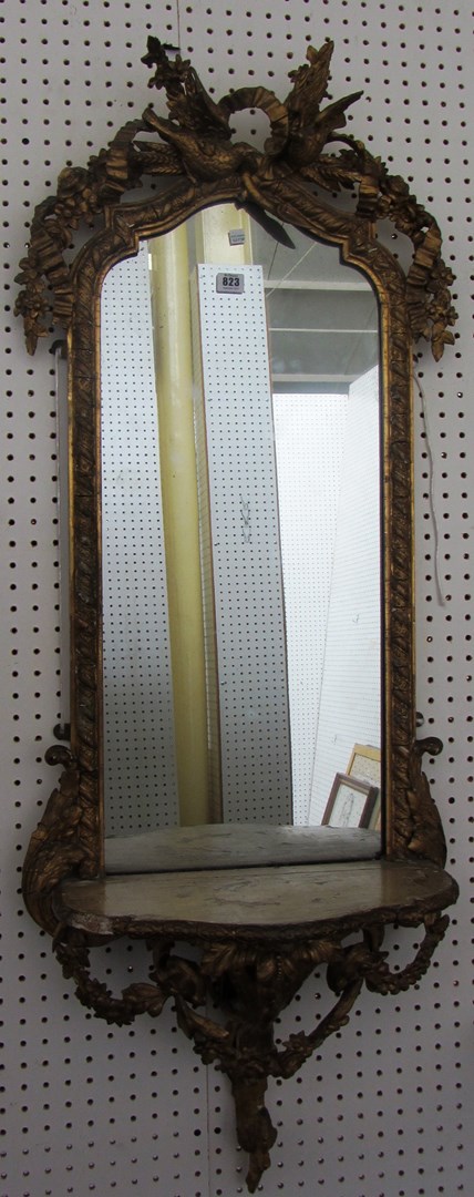 Appraisal: A Victorian gilt framed arch top pier glass with bird