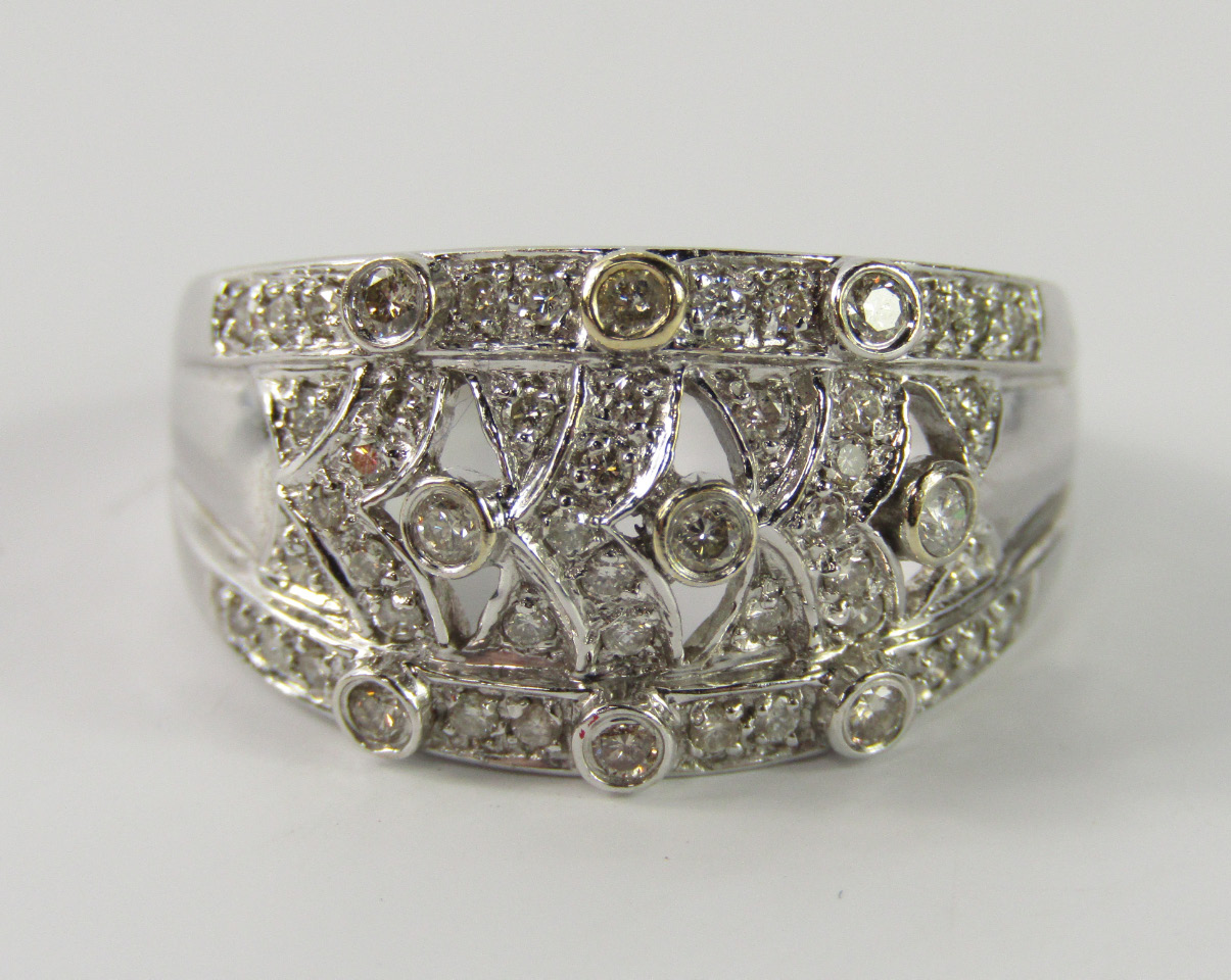 Appraisal: A white metal and diamond ring in an open fancy