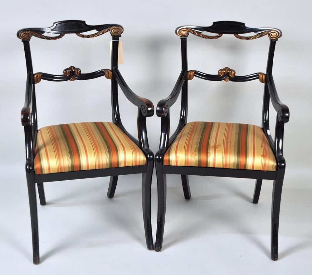 Appraisal: Pair Regency Carved Ebonized Arm Chairs with gilt swag accents