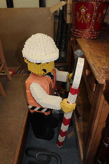 Appraisal: A LARGE LEGO MODEL in the form of a surveyor