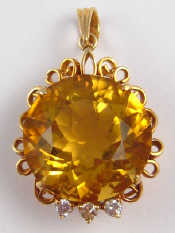 Appraisal: A carat gold citrine and diamond pendant approx cm wide