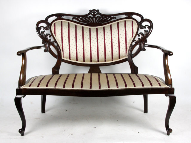 Appraisal: A two-seat settee with scrolling frame