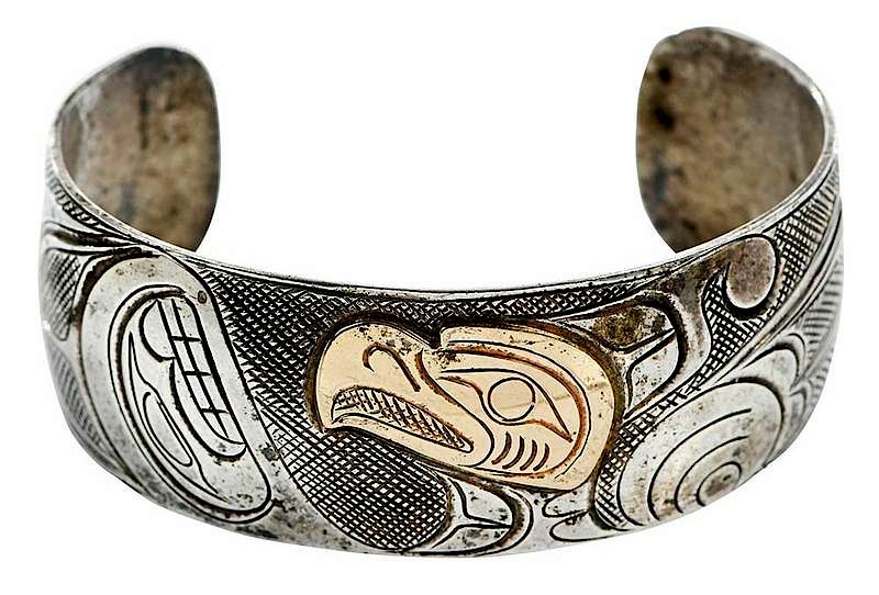 Appraisal: Northwest kt Gold and Silver Cuff Bracelet bird design engraved