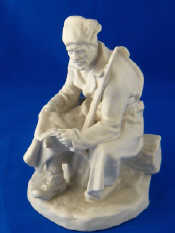 Appraisal: A Russian ceramic parian ware figure of a partisan resting