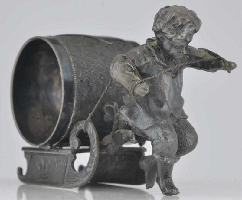 Appraisal: Boy Pulling Sleigh Figural Napkin Ring Wilcox Silver Co Size