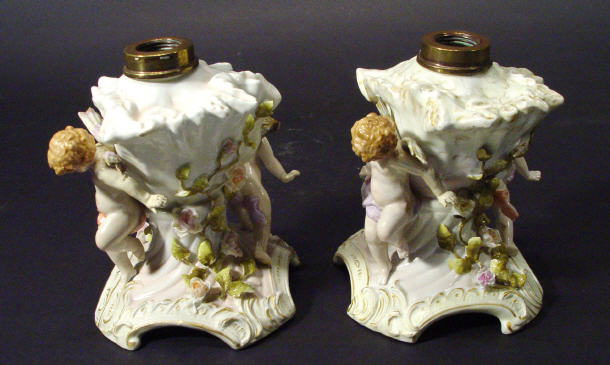 Appraisal: Pair of German porcelain table lamps modelled as shells supported