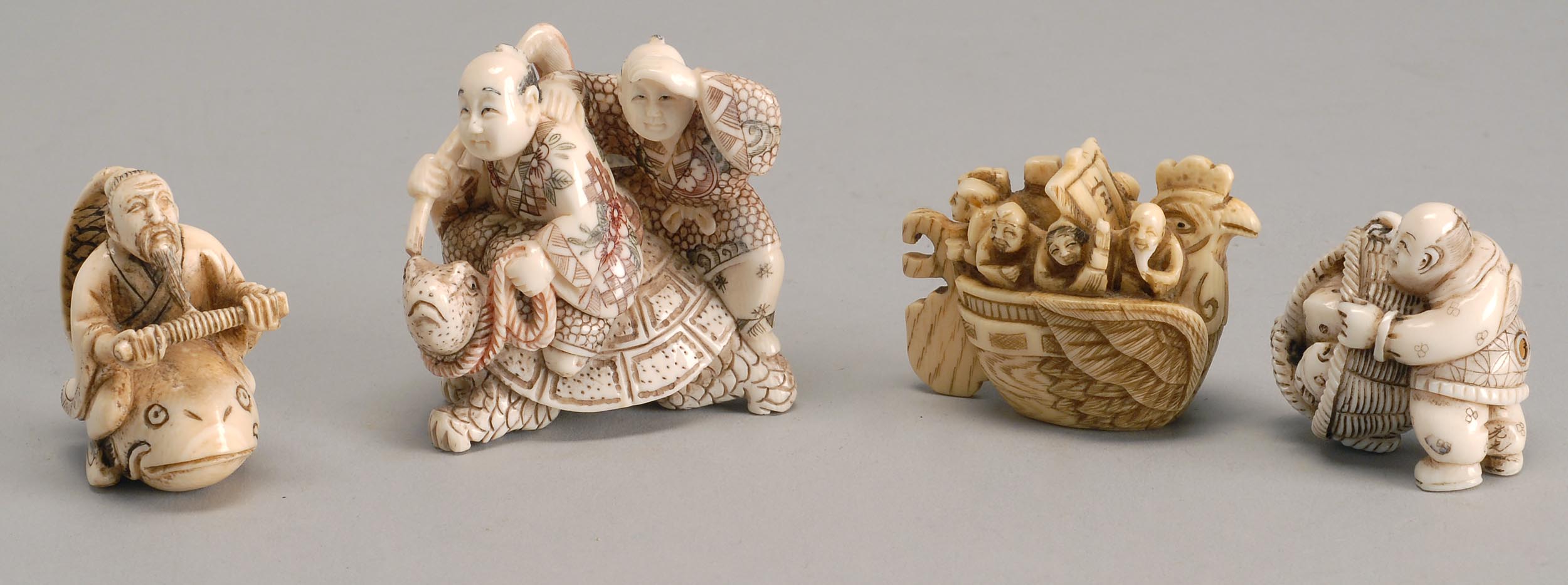 Appraisal: FOUR IVORY NETSUKE Takarabune with figures man with a basket