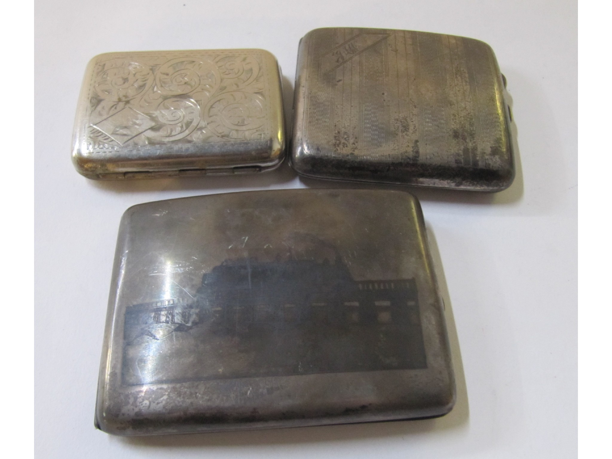 Appraisal: A lot comprising a silver cigarette case and two white