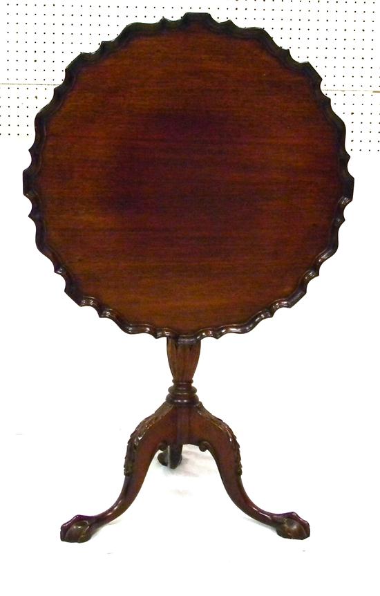 Appraisal: Chippendale style tilt top table mahogany pie crust edge urn