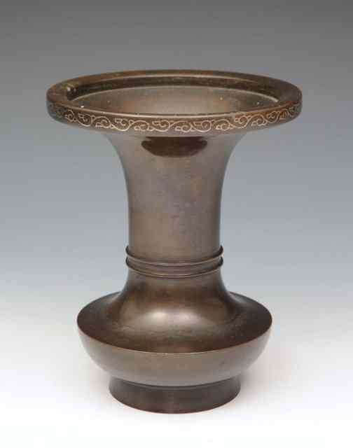 Appraisal: A CHINESE BRONZE BALUSTER VASE the rim with silver scroll