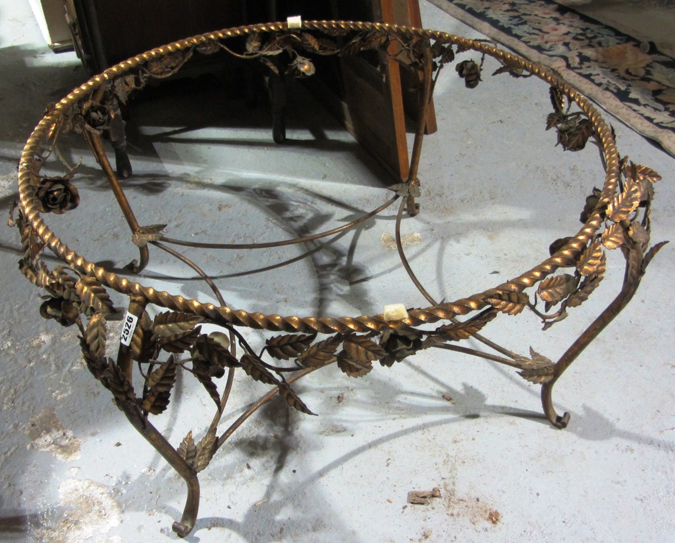 Appraisal: A gilt metal circular table base moulded with leaves