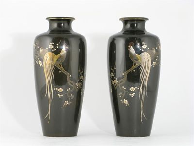 Appraisal: A pair of Japanese bronze vases decorated in silver and