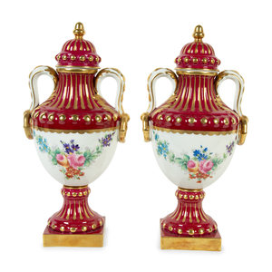 Appraisal: A Pair of Limoges Porcelain Urns th Century Height x