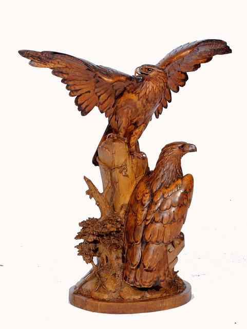 Appraisal: A SWISS 'BLACK FOREST' CARVING in the form of two