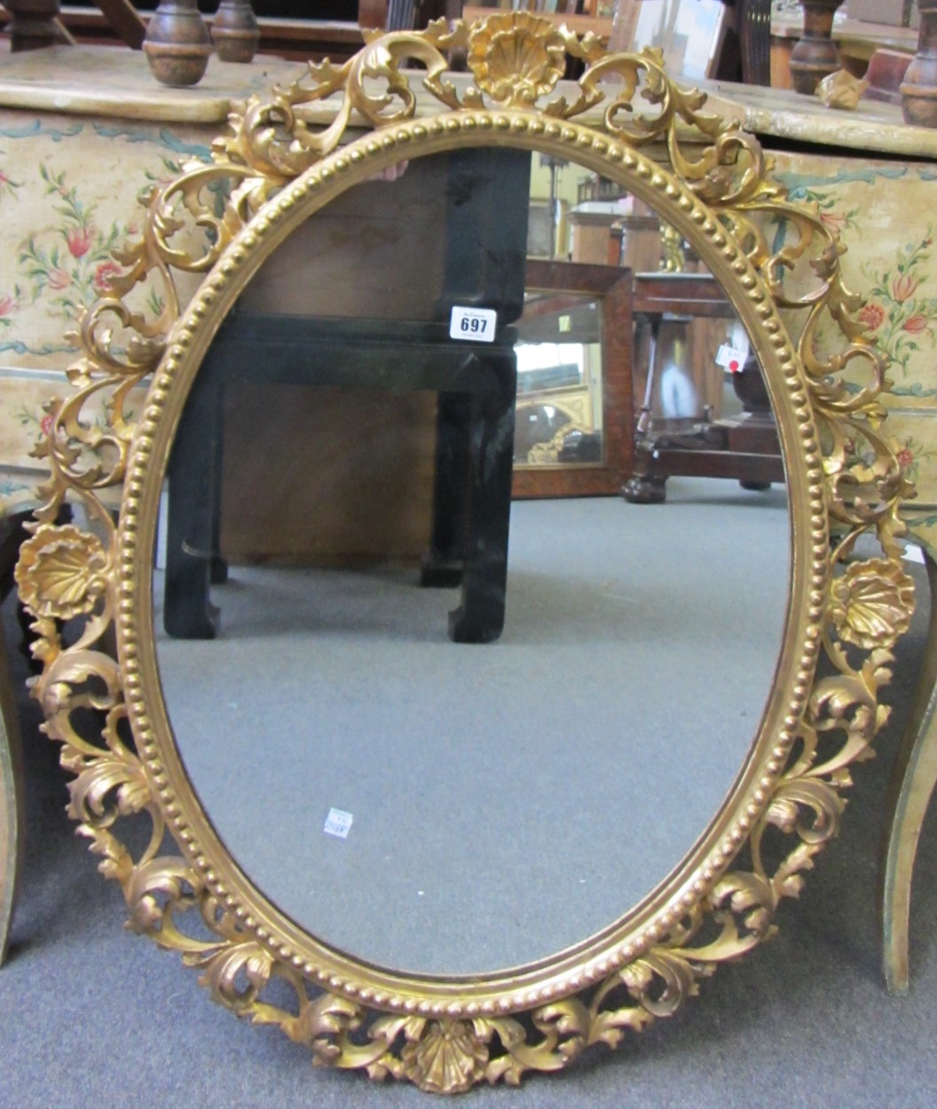 Appraisal: A late th century gilt framed oval wall mirror with