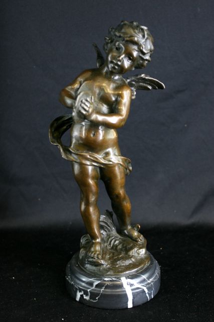 Appraisal: A bronze figure of a cherub playing cymbals cm high