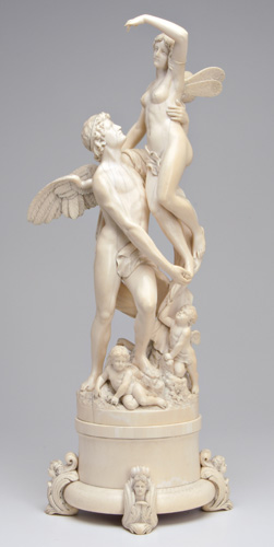 Appraisal: CONTINENTAL IVORY Carved Cupid and Psyche standing on an outcropping