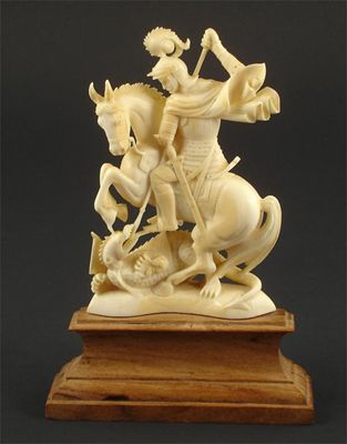 Appraisal: St George and The Dragon' an Ivory figure in the