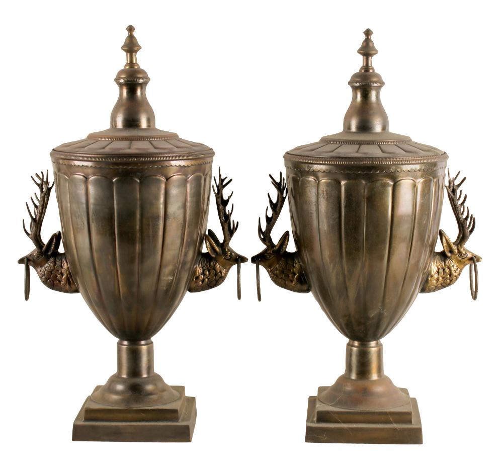 Appraisal: PAIR OF BRASS AND COPPER COVERED URNSunmarked each flanked by