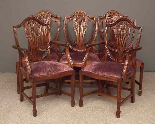 Appraisal: A set of eight modern mahogany shield back dining chairs