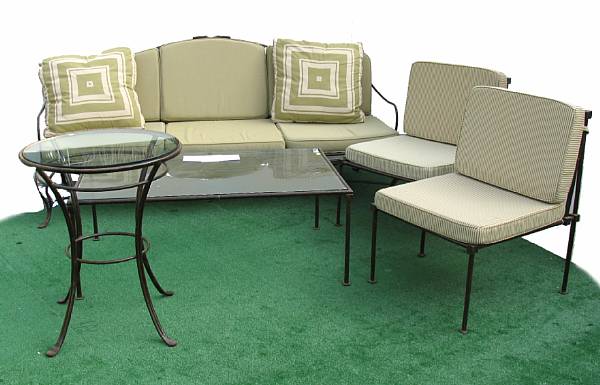 Appraisal: A wrought metal and marble topped patio dining set comprising