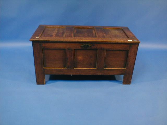 Appraisal: An oak three panel coffer raised on stiles wide high