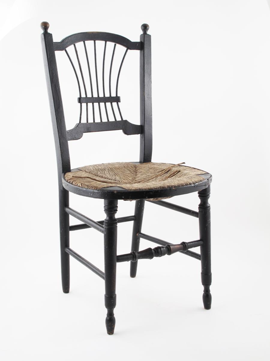 Appraisal: An ebonised wood Sussex chair