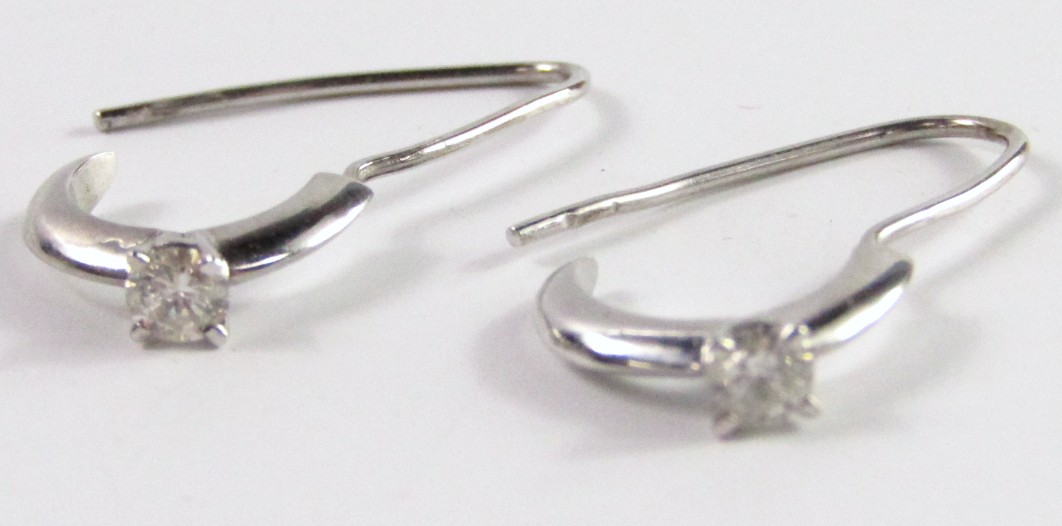 Appraisal: A pair of diamond set earrings mounted in white metal