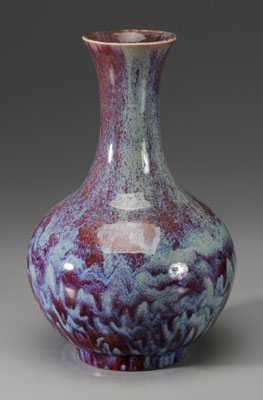 Appraisal: Flamb -Glazed Bottle Porcelain Vase Chinese th century thick purplish-red