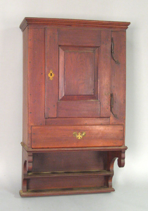 Appraisal: Pennsylvania walnut hanging cupboard late th c with rattail hinges