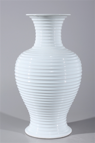 Appraisal: Chinese white glazed porcelain vase with ribbed design to body