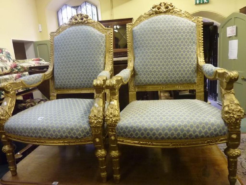 Appraisal: A pair of substantial open armchairs with upholstered seats and