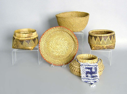 Appraisal: Four Native American baskets together with a gourd and beaded