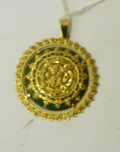 Appraisal: A GOLD PENDANT of circular form applied with a central