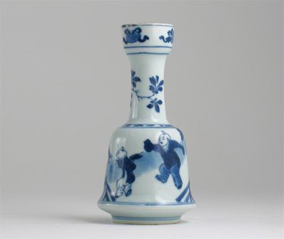 Appraisal: A Chinese blue and white bell-shaped candlestick decorated with the