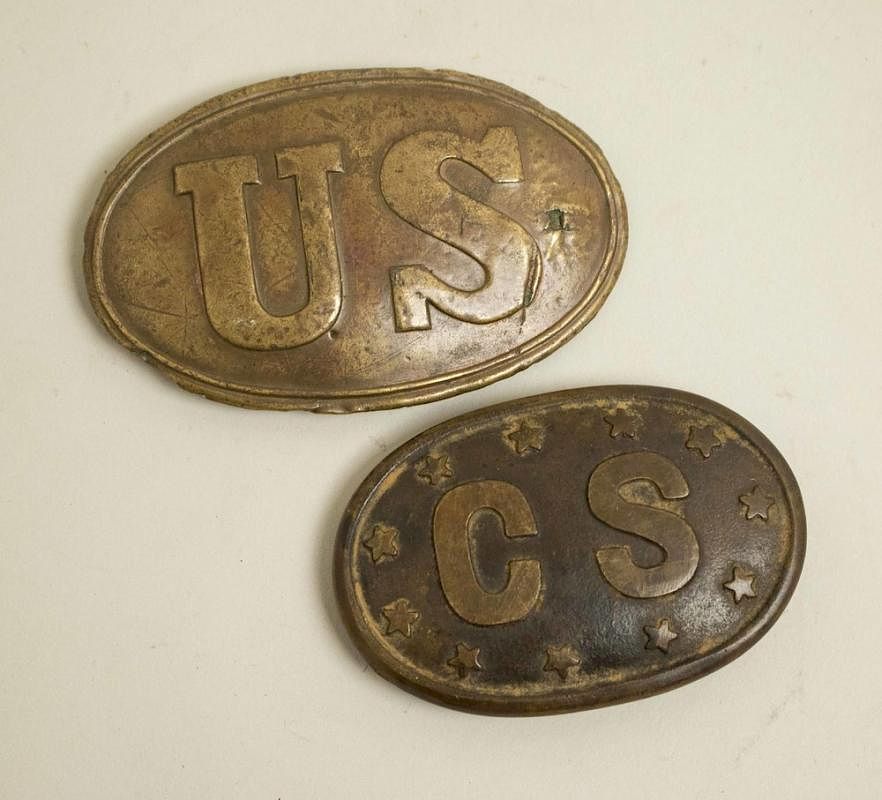 Appraisal: Two Buckles Two oval belt buckles One with raised letters