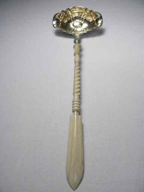 Appraisal: A th century punch ladle with a carved bone handle