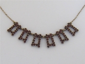 Appraisal: A French carat gold and garnet fringe necklace the fringe